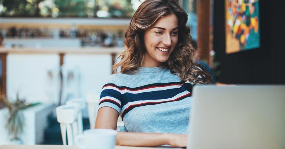 Woman-working-cafe-laptop