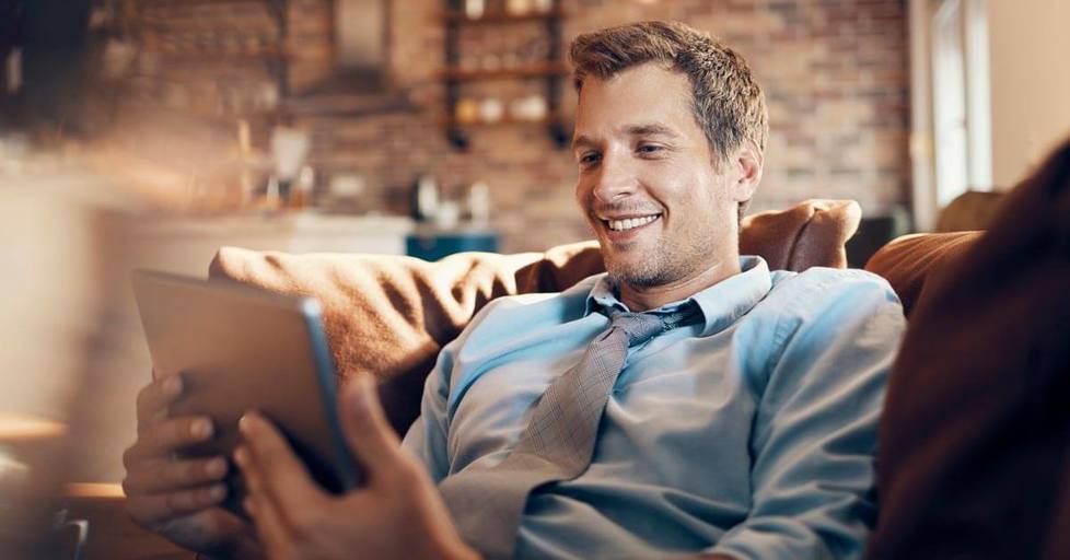 Man-using-tablet-smiling